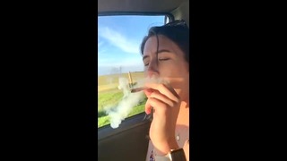 Naughy Brunette Rolls a Joint