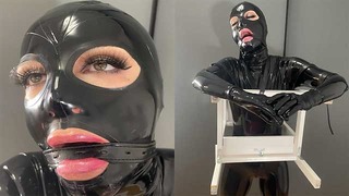 触摸恋物癖乳胶和 BDSM 夫妇穿着橡胶紧身衣顺从的奴隶被绑在束缚中